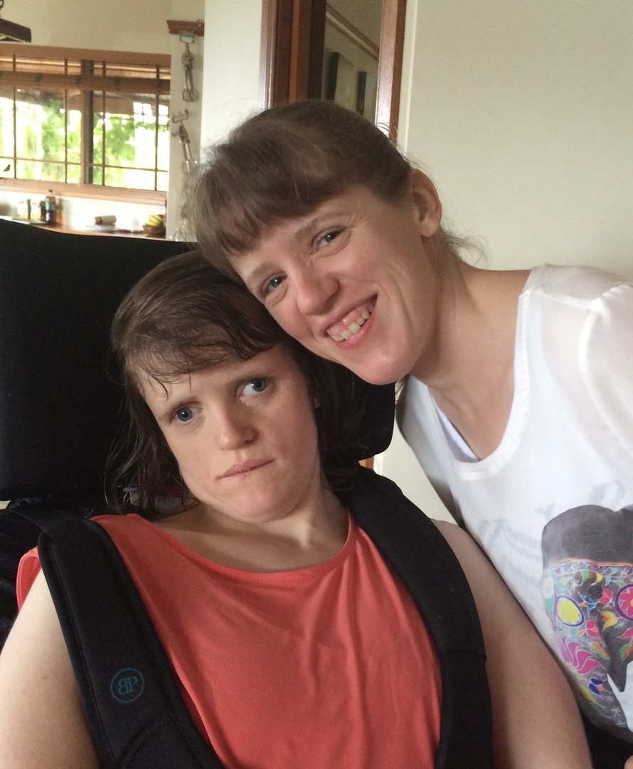 A mother sitting beside her child